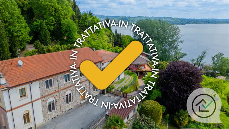 Vivi l’incanto del Lago: Bifamiliare con vista mozzafiato e accesso diretto alla natura